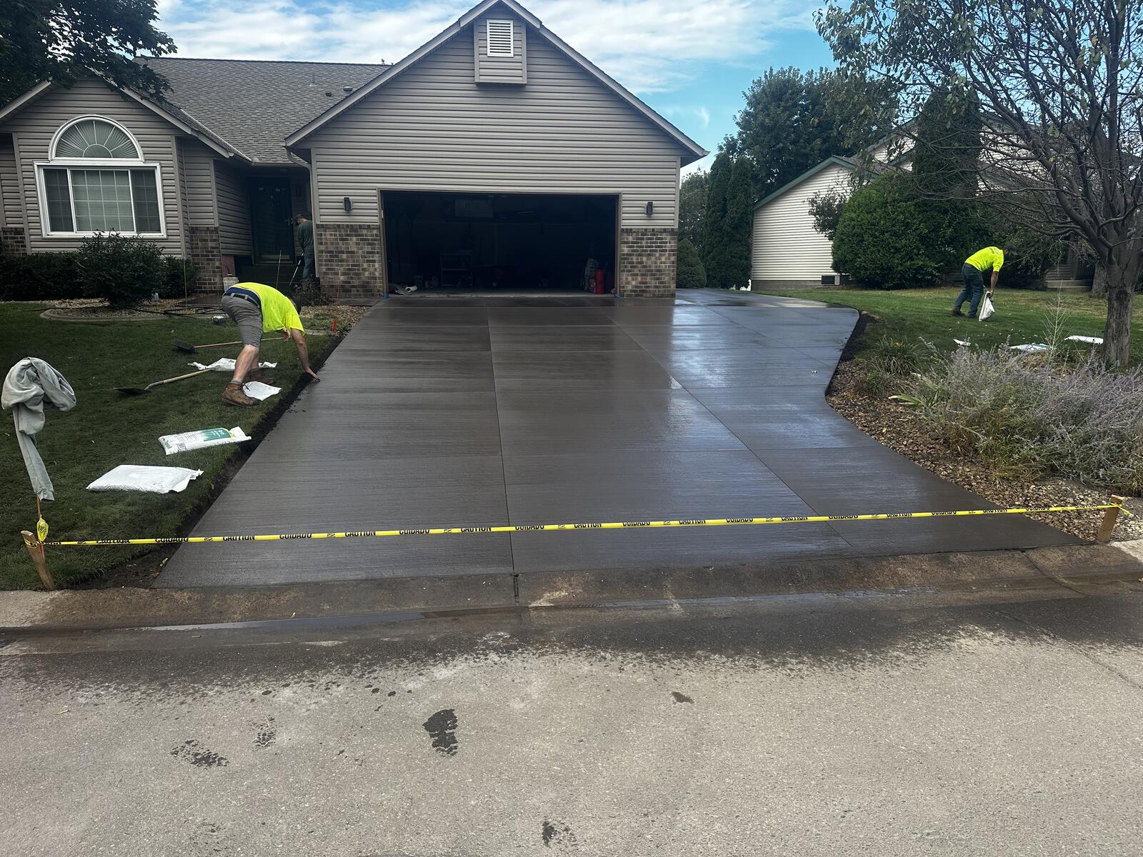 Fresh concrete driveway pour with crew in Brooklyn Park, MN
