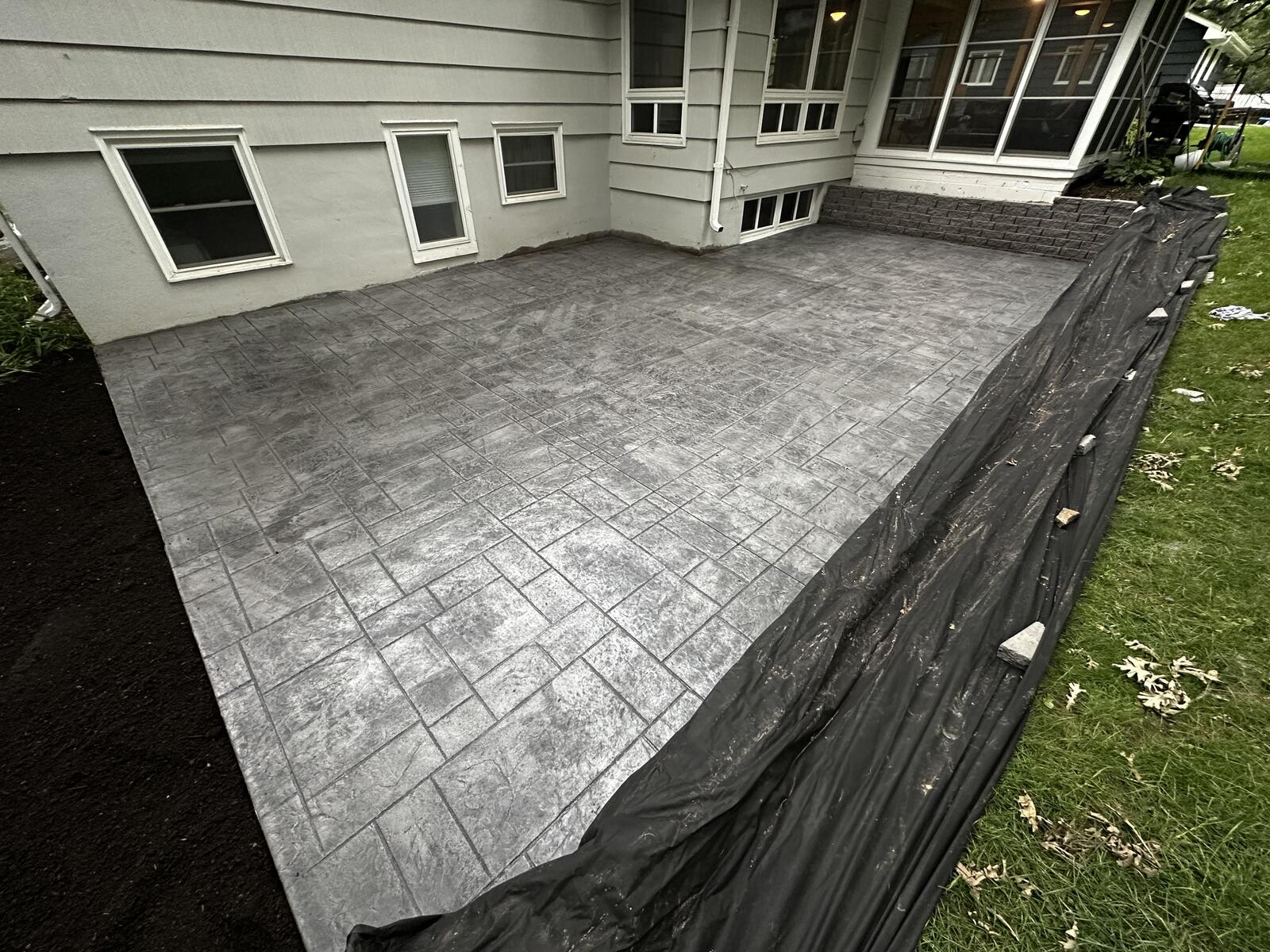 Stamped concrete fire pit area with decorative borders