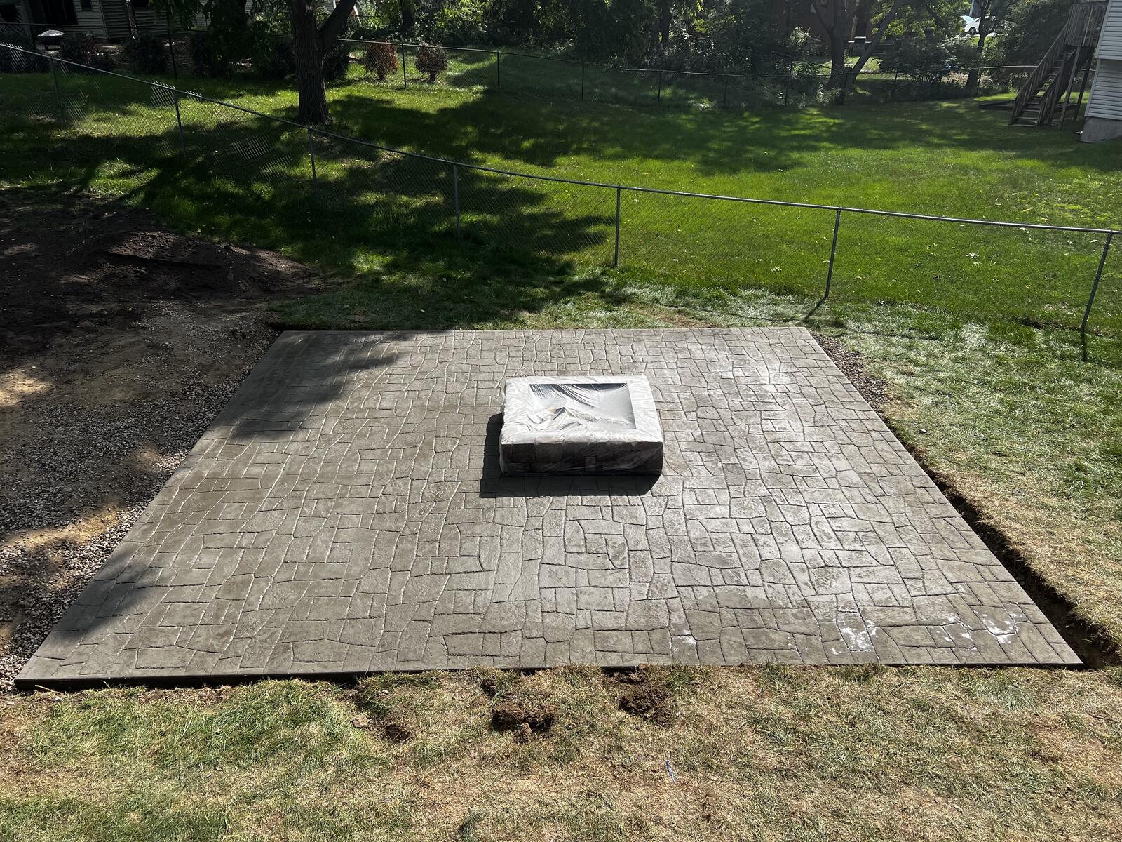 Stamped concrete outdoor kitchen area in Minneapolis suburb