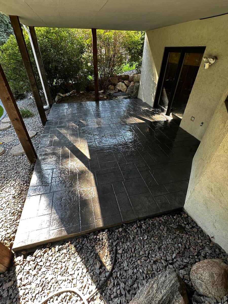 Stamped concrete sidewalk with natural stone appearance