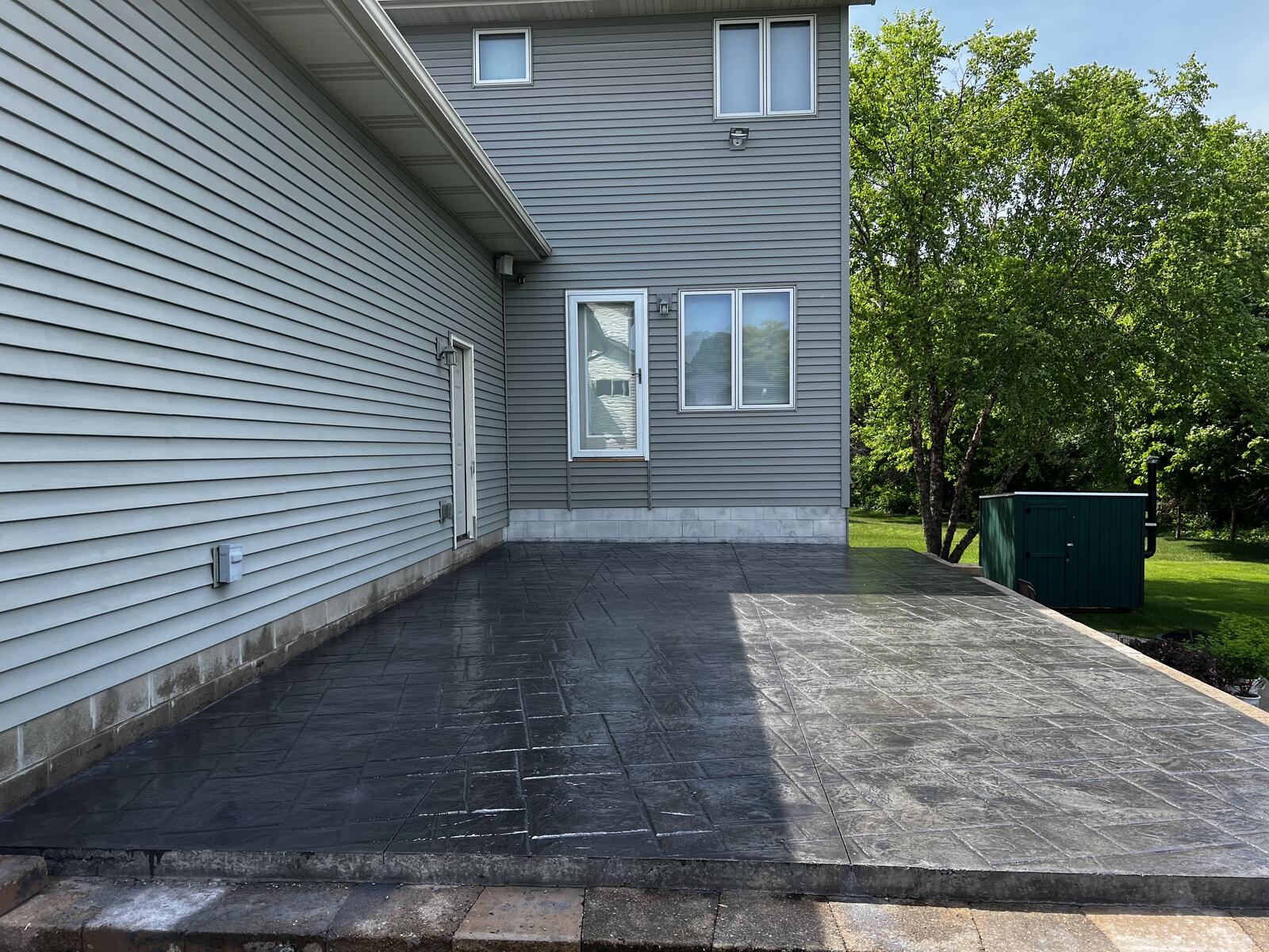 Stamped concrete residential patio with wood plank texture