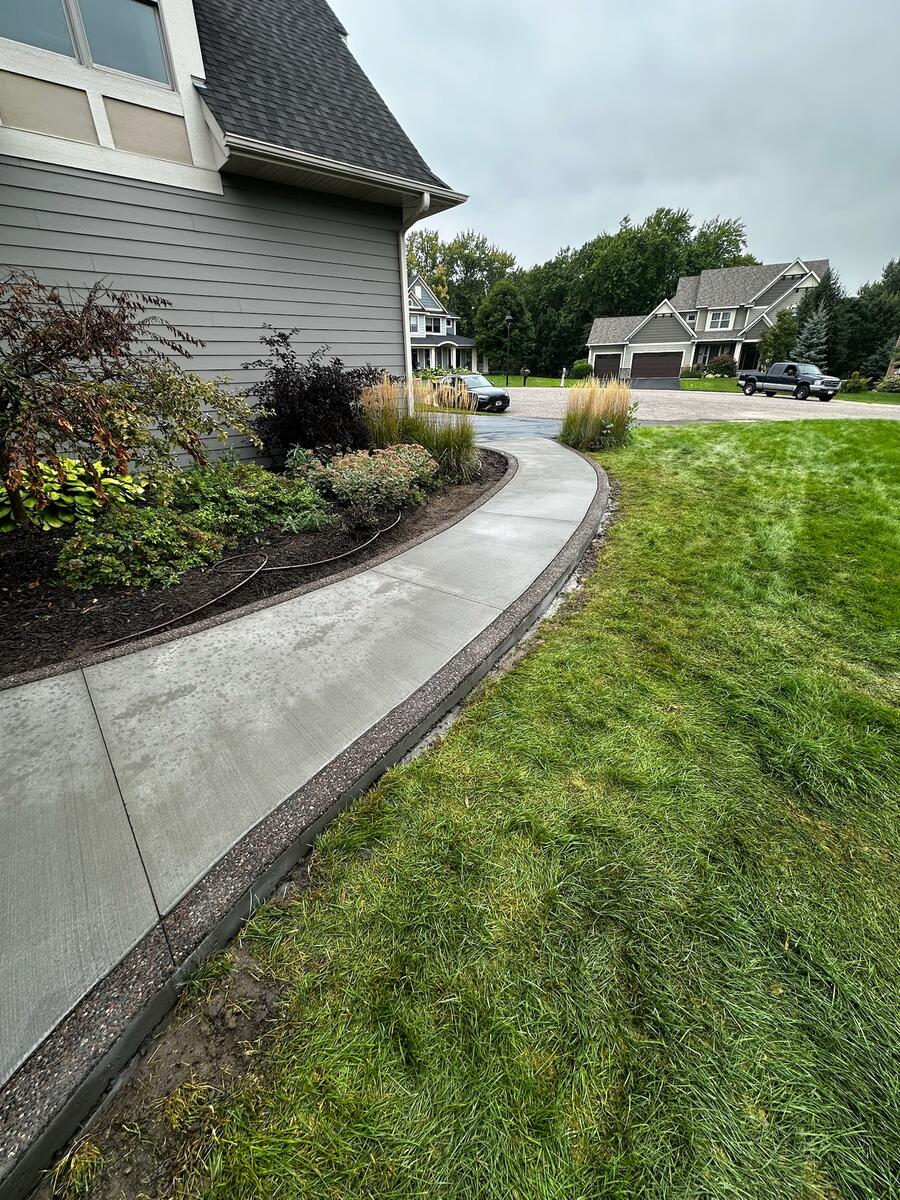 Stamped concrete patio with decorative stone pattern in NW Metro Minnesota